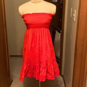 Salmon/orange eyelet strapless summer dress.